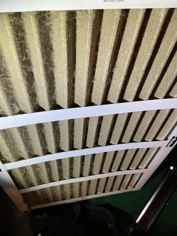 Completed preventive maintenance service on 13-year-old Amana air conditioning system. Performed comprehensive AC tune-up including system inspection, cleaning, and performance evaluation. A-coil showed moderate dust and debris accumulation consistent with system age, which was addressed during service. Air filter exhibited heavy soiling with significant dust buildup in pleated media, indicating extended service period. Cleaned components, verified system operation, and documented equipment condition with photos for maintenance records.