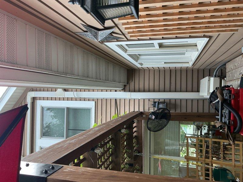Completed preventative maintenance on two mini-split systems, each with two indoor head units. Performed comprehensive tune-up including rinsing exterior condenser coils, cleaning all air filters, and clearing condensate drain lines. Verified system performance with temperature differential testing, measuring 16-degree delta-t on both units with outdoor ambient at 77°F and indoor at 68°F, confirming proper operation. Checked refrigerant levels on one unit and confirmed adequate charge; second unit's service ports were inaccessible due to furniture obstruction. Both systems operating within normal parameters. Photographed exterior condenser location per request for future relocation estimate to position unit on side of house between two windows.