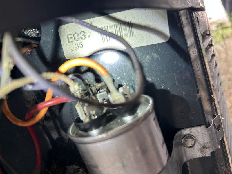 Performed routine maintenance agreement cooling visit on air conditioning system. Upon arrival, homeowner reported excessive noise during unit operation. Inspection revealed condenser fan motor bearings with lateral play and restricted rotation, indicating imminent failure. Motor was not achieving proper RPM, though system maintained adequate cooling performance. Replaced air filter and cleared condensate drain line. Performed condenser coil cleaning to remove accumulated dirt and debris from fins. Tested all system components and operations. Capacitor had been previously replaced by homeowner. Contactor showed signs of wear and pitting. Recommended replacement of condenser fan motor and contactor to prevent system failure and restore quiet operation. Advised that refrigerant pressures would be verified upon motor replacement to ensure optimal system performance.