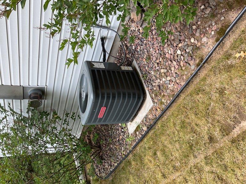 Performed comprehensive AC maintenance on outdoor condensing unit. Replaced air filter and removed significant pollen accumulation from capacitor. Verified system performance with 22° temperature split across evaporator coil, confirming proper refrigerant charge and operational efficiency. Capacitor tested within normal parameters with no deficiencies noted. Unit operating as designed with all components functioning properly.