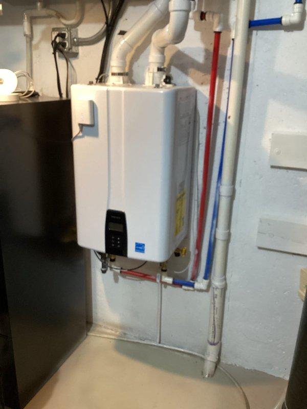 Completed comprehensive plumbing inspection of residential water heating and treatment systems. Performed maintenance flush on wall-mounted tankless water heater unit per homeowner request, removing mineral buildup and sediment to maintain optimal efficiency and extend equipment lifespan. Inspected associated plumbing connections including PEX supply lines, PVC venting system, and all mechanical components for proper operation. Verified water softener system with digital control head and brine tank functioning correctly. All equipment found in good working condition following service completion.