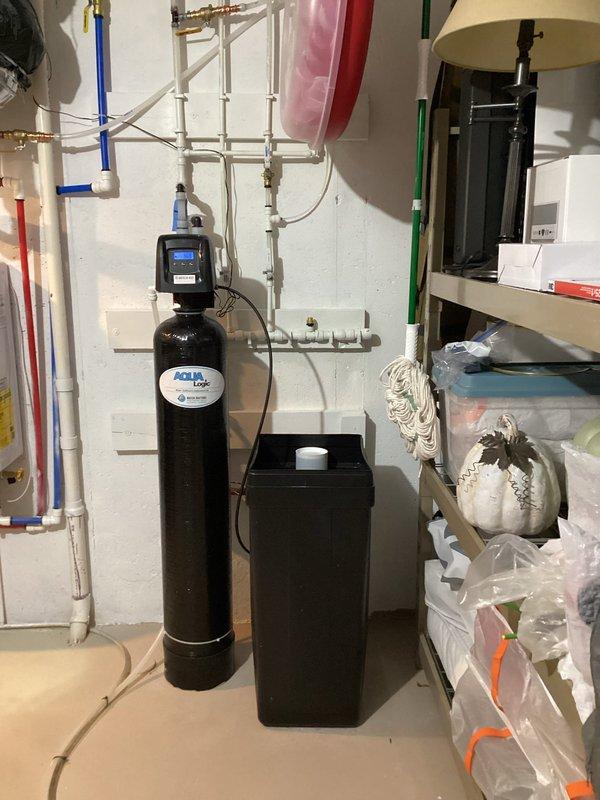 Completed comprehensive plumbing inspection of residential water heating and treatment systems. Performed maintenance flush on wall-mounted tankless water heater unit per homeowner request, removing mineral buildup and sediment to maintain optimal efficiency and extend equipment lifespan. Inspected associated plumbing connections including PEX supply lines, PVC venting system, and all mechanical components for proper operation. Verified water softener system with digital control head and brine tank functioning correctly. All equipment found in good working condition following service completion.