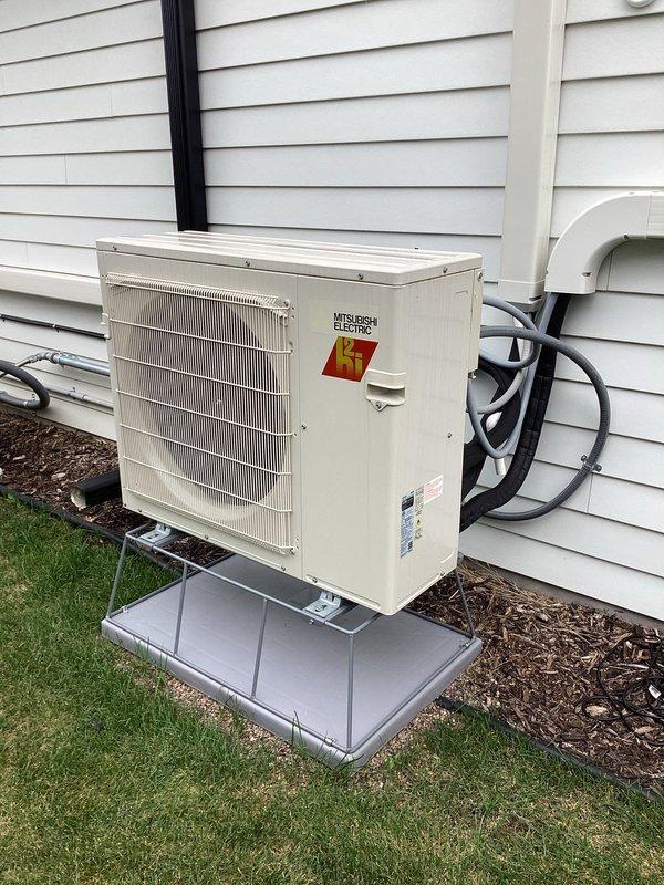 Responded to no cooling complaint on Mitsubishi Electric mini-split system installed 6 months prior. Upon arrival, outdoor unit was not running despite indoor unit powering on. System restored to full operation after homeowner cycled power at breaker while describing issue to technician. Consulted with technical support who confirmed unit likely entered fault state following power outage from backup generator cycling. Advised homeowner to cycle power at breaker panel if issue recurs. Inspected Aprilaire whole-home dehumidifier per homeowner concern regarding door sticking and humidity control. Verified dehumidifier operating within normal parameters but noted current duct configuration requires HVAC system blower operation for proper air circulation and dehumidification effectiveness. Documented equipment with photographs of outdoor condenser unit and dehumidifier control panel showing model and serial number information for service records.