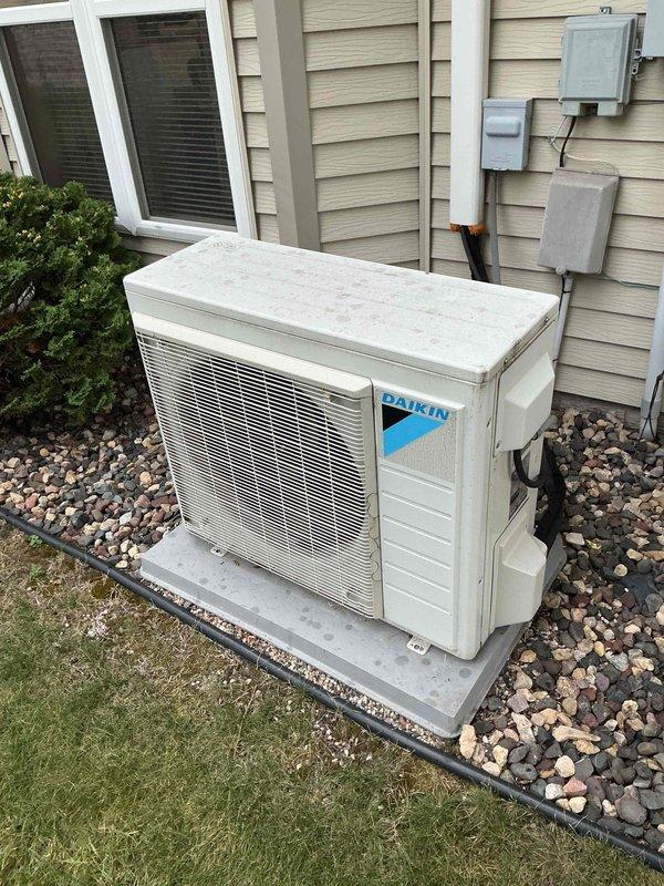 Performed comprehensive maintenance on Daikin mini-split heat pump system. Removed and cleaned indoor unit filters by rinsing thoroughly, then cleaned outdoor condenser coil. Inspected indoor unit housing for pest intrusion and verified cleanliness of internal components. Checked blower wheel condition and confirmed evaporator drain line was clear and draining properly. Started system and monitored operation for 20 minutes, verifying proper cooling performance with 20-degree temperature differential across the evaporator coil. System operating within normal parameters.