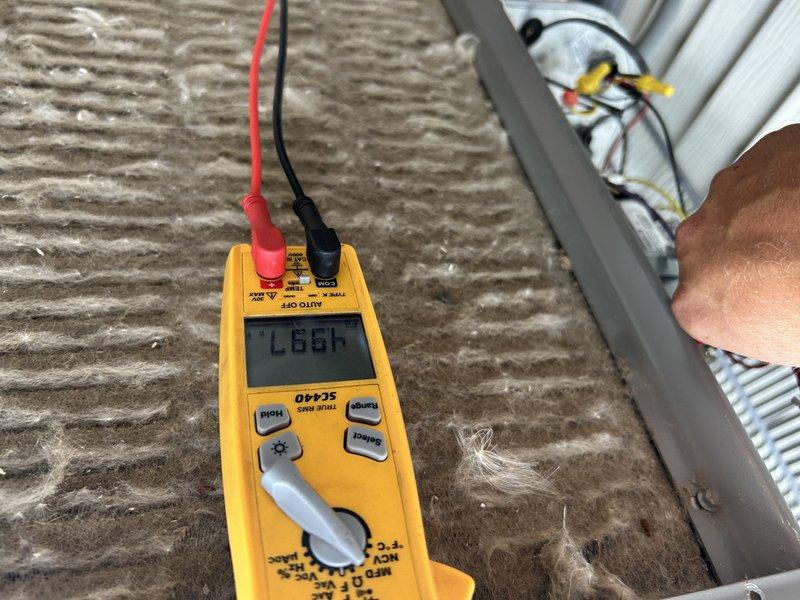 Performed comprehensive AC tuneup on three-year-old unit, including operational testing, condenser coil cleaning, air filter replacement, and condensate drain clearing. Conducted electrical diagnostics with multimeter and inspected all system components. Identified noisy condenser fan motor requiring replacement; unit otherwise operating within normal parameters, and follow-up visit scheduled to install new motor.