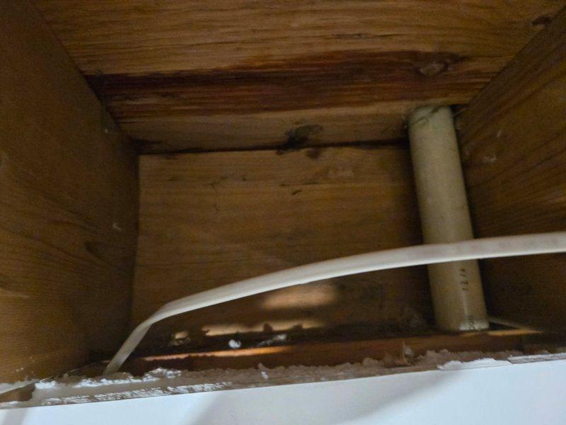 Responded to water leak originating from upstairs kitchen sink area with water infiltration into basement below. Upon investigation, identified small pinhole leak in copper supply line serving kitchen sink, located behind wall cavity. Accessed affected plumbing through basement crawl space. Removed compromised section of copper piping and replaced with PEX tubing to restore water supply integrity. Tested system for proper flow and verified leak elimination. Documented existing water damage to basement ceiling and wall surfaces for customer awareness.