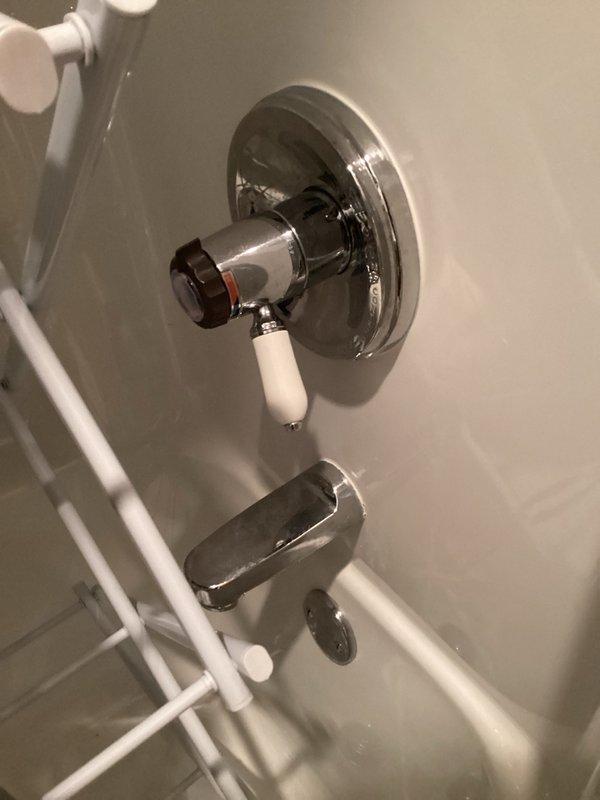 Completed comprehensive plumbing inspection including evaluation of bathroom fixtures and hot water recirculating system. Inspected shower valve assembly with chrome fixtures and porcelain handle, bathtub spout, and associated plumbing connections, confirming proper operation and no visible leaks. Examined Grundfos UP 15-18 SU hot water recirculation pump installation in mechanical space, verifying pump operation, electrical connections to control relay, copper piping integrity, brass fittings, shutoff valves, and associated PVC drainage lines, with all components functioning within normal parameters.