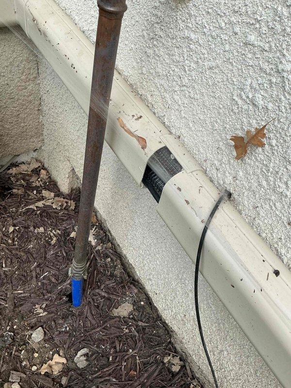 Responded to warranty call for three recently installed mini-split systems reported as non-operational with green indicator lights flashing and louvers failing to engage. Upon arrival, unit was functioning properly. Performed comprehensive system inspection and identified multiple installation deficiencies requiring correction. Inspected and verified proper electrical connections at outdoor disconnect panel, ensuring all wiring terminations were secure and compliant with manufacturer specifications. Relocated condensate drain line from improper placement in mulch bed to prevent blockage and ensure proper drainage function. Secured loose lineset protection cover that was not properly fastened during initial installation. Documented damaged lineset protection component on second unit and submitted parts request form for replacement. All accessible systems tested and verified operational at time of departure. Corrective actions completed to address installation oversights and ensure prope