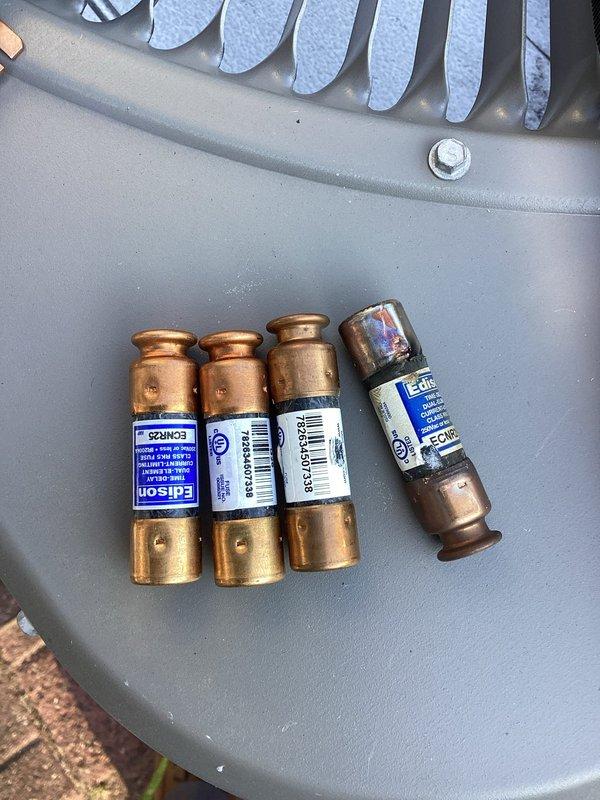 Performed annual cooling system maintenance as part of preventative maintenance agreement. During inspection, discovered failed fuses in the outdoor AC unit. Replaced defective fuses with new Edison-brand cartridge fuses to restore proper electrical protection and system functionality.