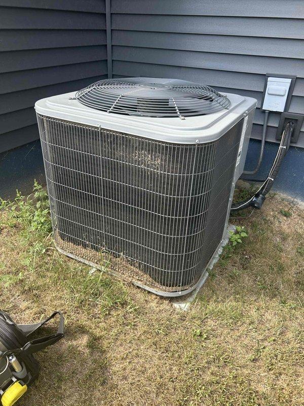 Completed preventive maintenance tune-up on residential air conditioning system as part of membership agreement. Performed standard inspection and servicing of outdoor condenser unit, including evaluation of refrigerant lines, electrical disconnect, and overall system operation. No deficiencies identified; unit found in satisfactory working condition with normal outdoor weathering present on exterior components.