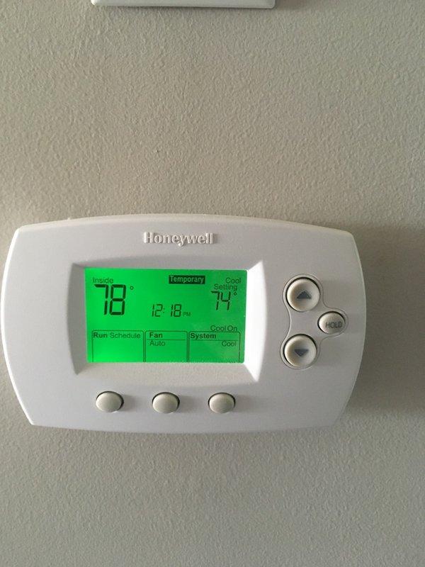 Responded to no cooling complaint on 10-year-old Carrier AC system. Found outdoor unit fan operating but compressor not running. Diagnosed failed dual run capacitor with low microfarad reading on compressor terminal. Replaced defective capacitor with proper OEM replacement, restoring compressor operation and normal cooling function immediately upon startup.