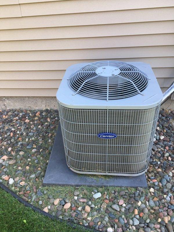 Responded to no cooling complaint on 10-year-old Carrier AC system. Found outdoor unit fan operating but compressor not running. Diagnosed failed dual run capacitor with low microfarad reading on compressor terminal. Replaced defective capacitor with proper OEM replacement, restoring compressor operation and normal cooling function immediately upon startup.