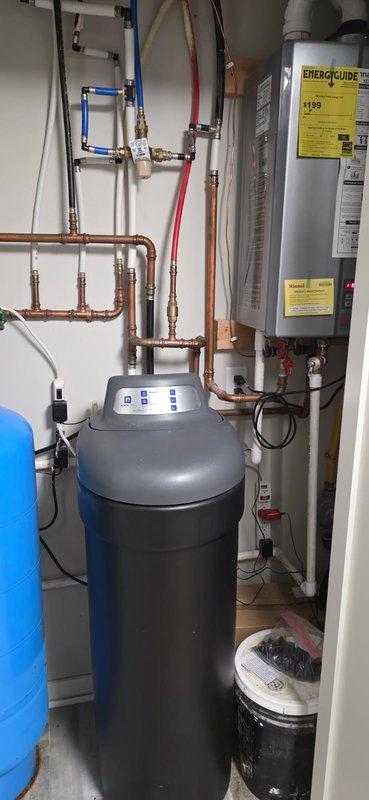 Serviced a 5-year-old Northstar water softener system that had never received maintenance and was experiencing operational issues with iron deposits and water conditioning problems. Diagnosed and addressed electrical contact failures, replaced faulty nozzle and venturi assembly which was significantly clogged with mineral buildup. System was cycled and homeowner instructed to monitor performance before scheduling follow-up appointment to verify proper operation.