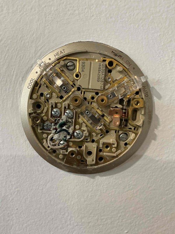 Removed existing mechanical thermostat from wall and disconnected legacy wiring from terminals. Installed customer-supplied Nest battery-operated WiFi thermostat to existing wall opening, connecting HVAC system wiring to new thermostat base according to manufacturer specifications. Verified proper system communication and tested heating and cooling functions to ensure successful operation of smart thermostat.