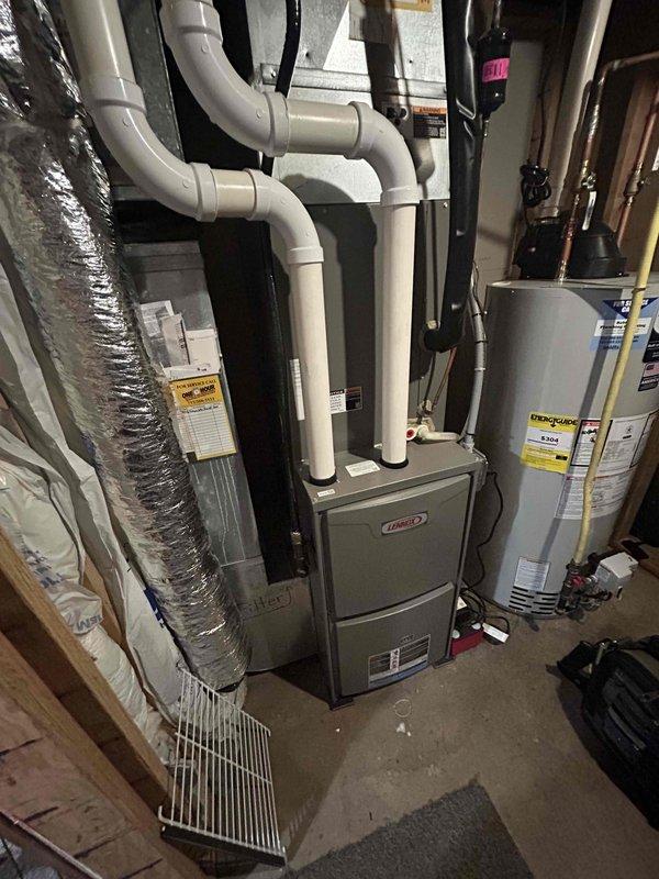 Completed comprehensive AC tune-up on 2-year-old Lennox system per customer concern that air doesn't feel as cold as expected. Performed full maintenance inspection on outdoor condenser unit, which showed significant dirt and debris accumulation on exterior surfaces, louvers, and coils from extended outdoor exposure. Thoroughly cleaned condenser coils and exterior components to restore proper airflow and heat transfer efficiency. Inspected indoor furnace unit and associated ductwork in mechanical room, verified all connections and venting systems. Tested system operation and confirmed unit is now functioning properly with improved cooling performance following cleaning and maintenance procedures.