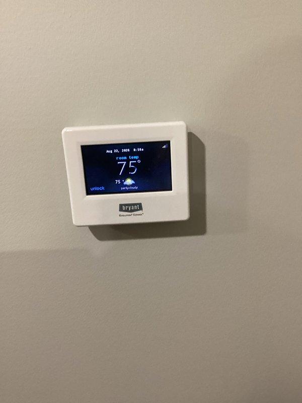 Completed scheduled heating maintenance on 10-year-old Bryant HVAC system. Performed comprehensive tune-up inspection with no issues identified. Verified Bryant Evolution Connex thermostat operation at 75°F setpoint and tested system diagnostics at condensate drain line using digital measurement tools to confirm proper operation and drainage function.