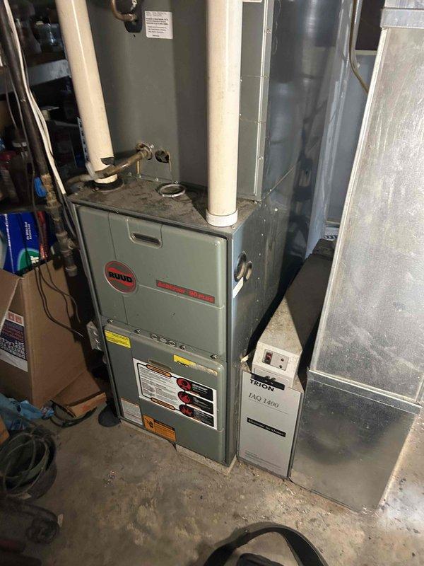 Completed comprehensive furnace tune-up on Ruud heating system as part of preventative maintenance agreement. Performed standard inspection procedures including burner assembly cleaning, heat exchanger examination, blower motor lubrication, filter assessment, flue pipe inspection, and safety control verification. All system components found operating within manufacturer specifications with no deficiencies noted; unit left in proper working condition.