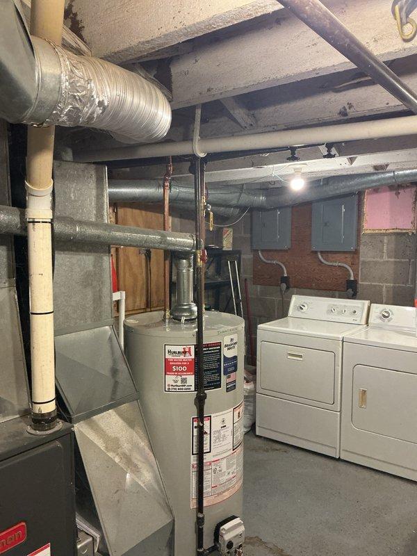 Responded to a water heater emergency where the existing unit was leaking from the bottom due to age-related deterioration. Upon assessment, determined the tank had failed and required full replacement rather than repair. Removed the old water heater and installed a new 40-gallon natural gas standard vent water heater manufactured by Bradford White Corporation. Connected all gas lines, water supply lines, and venting per manufacturer specifications and local code requirements. Verified proper operation, checked for leaks, and ensured all safety controls were functioning correctly before completing the installation.