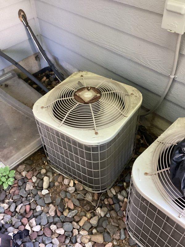 Responded to no cooling complaint on 14-year-old Payne residential condenser unit, model PA13NA024BN0. Upon arrival, found downstairs air conditioning system running but not producing cool air. Performed diagnostic evaluation and discovered failed dual run capacitor preventing compressor from operating properly. Replaced defective capacitor with appropriate replacement unit and restored system to operational status. Verified proper system operation by measuring temperature splits across evaporator coil, confirming readings within manufacturer specifications. System tested and confirmed cooling effectively post-repair. Noted existing concerns with associated furnace's secondary heat exchanger based on equipment history; recommend ongoing monitoring for safety. Provided estimate for system replacement considerations given age of equipment. Unit operational at time of departure.