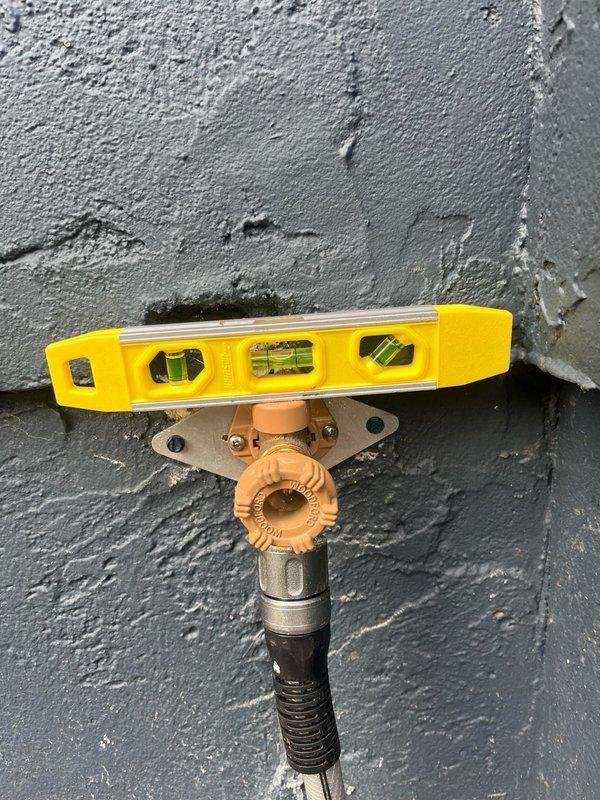 Responded to callback regarding recently replaced outdoor spigot that was rotating approximately 40 degrees in either direction. Upon inspection, confirmed spigot remained attached to wall but exhibited excessive flexibility that concerned the homeowner. Installed additional mounting bracket and reinforcement plate to eliminate movement and provide rigid, secure installation. Verified proper alignment and stability of fixture upon completion.