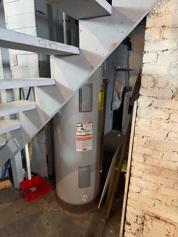 Responded to a no hot water complaint affecting the entire residence. Upon arrival, diagnosed an electric water heater with a tripped breaker and failed lower thermostat causing inadequate water heating. Reset the breaker and tested both upper and lower thermostats to confirm malfunction. Replaced both the upper and lower thermostats as a preventative measure to ensure reliable operation and restore full hot water capacity to the home.