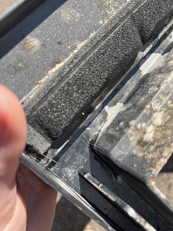 Responded to repair request for HVAC drain pan replacement. Upon inspection, discovered three cracks in the existing drain pan that were causing water leakage. Removed the damaged drain pan and installed a new replacement unit. Performed thorough water testing on the newly installed drain pan to verify proper water retention and drainage functionality. Confirmed all water flows correctly through the drain system without leakage. Job required two technicians due to equipment access and positioning requirements.