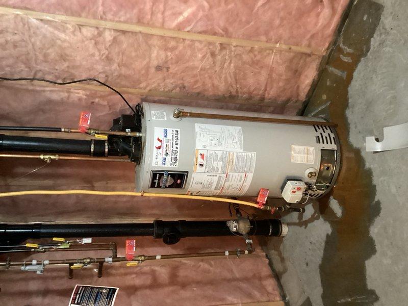 Responded to a no hot water call and diagnosed a leaking water heater requiring replacement. Conducted thorough inspection of the existing tanked water heater unit, identifying active leaks compromising system integrity and performance. Provided detailed estimate for complete water heater replacement, documenting all necessary components including new tank unit, associated piping connections, gas line configurations, temperature and pressure relief valve, expansion tank, and required code-compliant installations. Coordinated scheduling for full unit swap-out to restore hot water service to the property.
