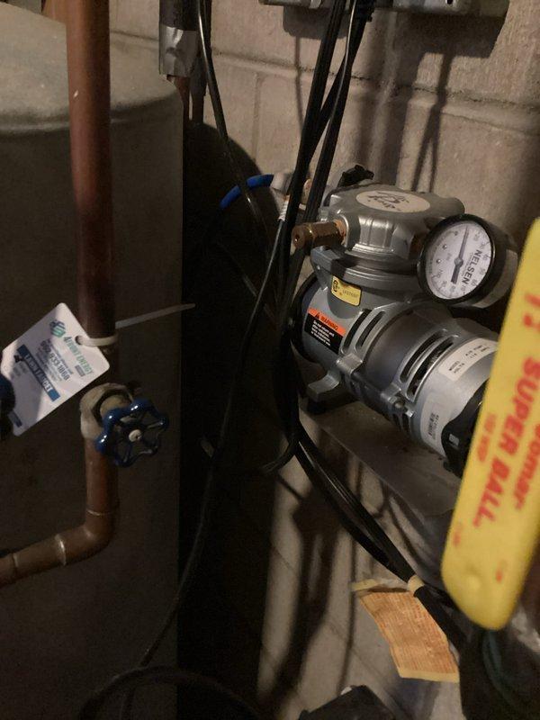 Responded to water leak in utility room originating from pipe connected to outside faucet. Upon arrival, water supply was already shut off. Inspection revealed leaking inside hose bib valves caused by loose bleeder valve caps that had not been properly tightened. Tightened all bleeder valve caps to manufacturer specifications, resolving the leak issue.