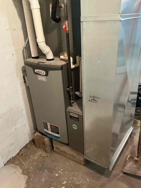 Completed scheduled maintenance agreement service on Lennox furnace system. Performed comprehensive tune-up including cleaning flame sensor, verifying condensate drain operation, inspecting and confirming pressure switch hoses were clear, checking blower wheel condition and speed settings, and replacing dirty air filter with new unit provided by homeowner. System started and brought to operating temperature with proper performance confirmed at 62° temperature rise across heat exchanger.