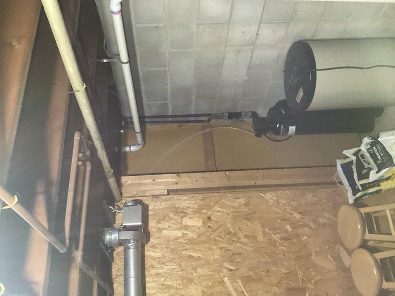 Responded to water leak in unfinished basement originating from kitchen sink branch line during dishwasher drainage. Upon arrival, discovered kitchen drain backing up and overflowing through the water softener standpipe, causing significant water accumulation on basement floor. Diagnosed the issue as a blocked drain line rather than a venting problem. Performed mechanical snaking of the kitchen drain line to clear the obstruction and restore proper drainage flow. Verified all fixtures were draining correctly and confirmed no further backup was occurring through the softener standpipe. Water main shutoff was not required during repairs, allowing household water service to remain operational throughout the procedure.