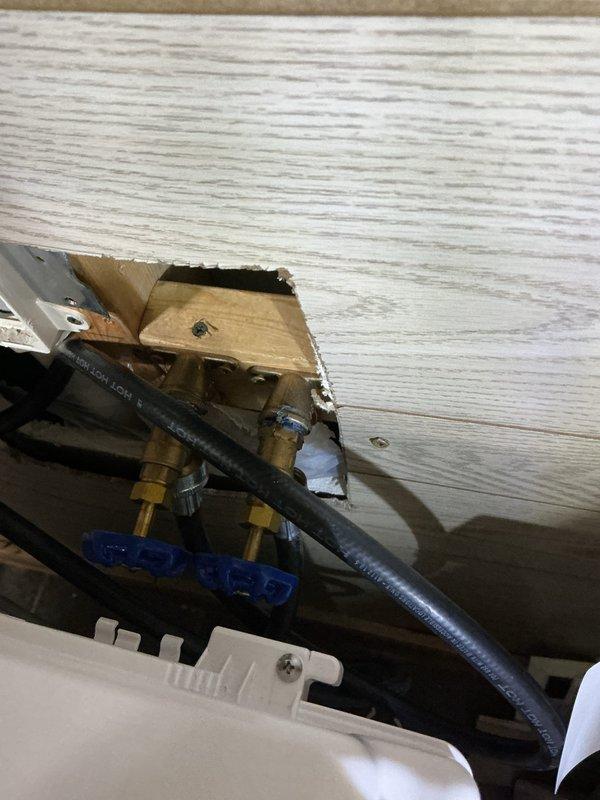 Responded to service call for leaking washing machine supply valves that required main water shut-off to stop the leak. Upon inspection, determined that the hot and cold water supply valves serving the washing machine were defective and beyond repair. Replaced both faulty washing machine valves with new brass shut-off valves featuring quarter-turn operation. Installed new flexible supply lines to ensure proper connection to the appliance. Tested all connections for leaks and verified proper valve operation. System restored to full functionality with accessible shut-off capability.