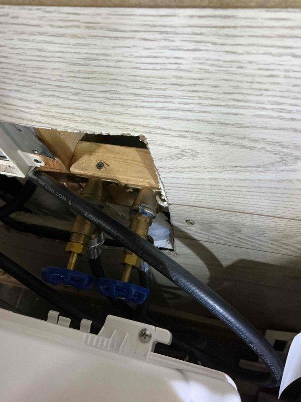Responded to service call for leaking washing machine supply valves that required main water shut-off to stop the leak. Upon inspection, determined that the hot and cold water supply valves serving the washing machine were defective and beyond repair. Replaced both faulty washing machine valves with new brass shut-off valves featuring quarter-turn operation. Installed new flexible supply lines to ensure proper connection to the appliance. Tested all connections for leaks and verified proper valve operation. System restored to full functionality with accessible shut-off capability.