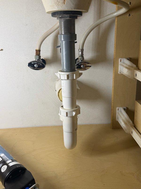 Installed customer-supplied toilet with complete plumbing connections. Replaced five angle stops (shut-off valves) with new chrome-finished fixtures and installed braided stainless steel supply lines. Reinstalled pop-up drain assembly to ensure proper function and seal. All connections tested for leaks and verified operational.