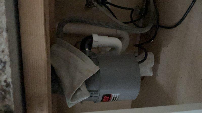 Responded to service call for garbage disposal evaluation. Upon inspection, determined existing disposal unit had failed and was beyond repair. Provided estimate for replacement, received approval, and successfully installed new garbage disposal unit. Additionally performed minor repair by tightening loose kitchen faucet to ensure proper operation. Documented completed work with photos.