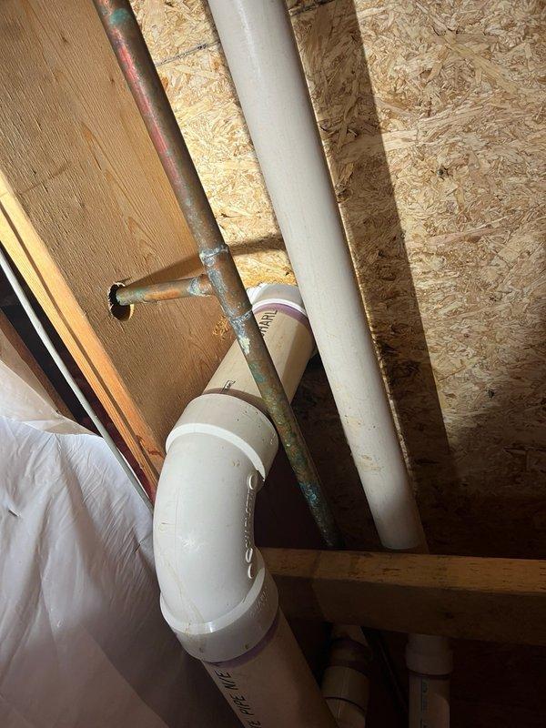Responded to reported water leak near toilet fixture. Upon inspection, no active water leakage was detected at the base of the toilet or from the wax ring seal. Investigation revealed condensation accumulation on the exterior surface of the toilet tank and bowl, with caulking around the base displaying a glossy, wet appearance consistent with moisture exposure rather than a plumbing leak. Assessed the existing toilet fixture and determined it to be the original unit installed with the home, showing age-related wear. Provided estimates for toilet replacement options to address the aging fixture and potential future issues.
