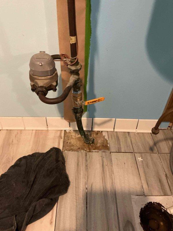 Responded to emergency call for broken main water shut-off valve causing active leak in utility area. Coordinated with city water department to shut off water supply at street level while awaiting their arrival window. Upon water shutdown, removed failed main shut-off valve assembly and installed new replacement shut-off valve with proper fittings and connections. Tested new valve for proper operation and verified no leaks at connection points. Restored water service and confirmed system integrity.