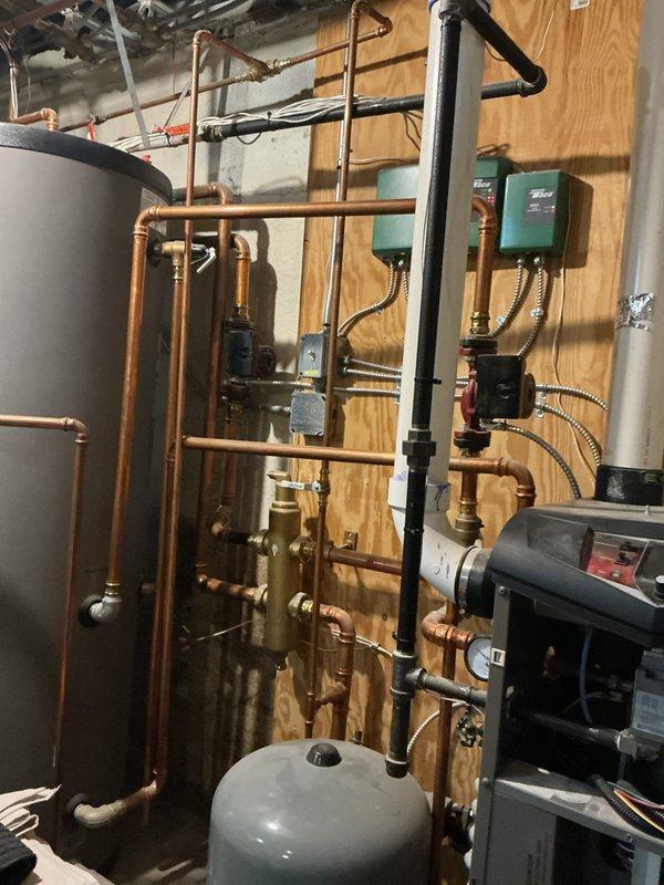 Completed annual heating tune-up on 7-year-old Lennox system and performed boiler inspection. Found boiler operational but running at low pressure; added water to system to meet manufacturer's specified pressure requirements. Inspected hydronic heating system including circulator pumps, zone valves, manifold distribution system, expansion tank, and associated copper piping—all components found to be functioning properly following pressure adjustment.