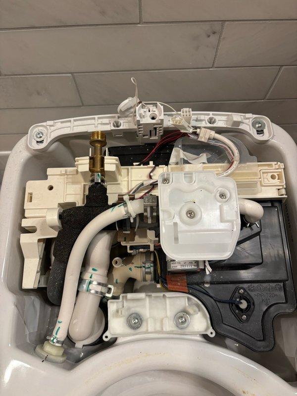Responded to service call for malfunctioning Toto Neorest 750H toilet with integrated bidet system. Upon inspection, diagnosed failed flush valve and bowl controller affecting lower bowl operation. Removed defective components and installed new OEM flush valve assembly and bowl controller unit. Reconnected all electrical wiring harnesses and plumbing connections to internal control systems. Performed operational testing of all toilet functions including flush cycles, bidet spray settings, and electronic controls. Verified proper water flow, drainage, and sensor response. Cleaned work area and confirmed unit restored to full working order with all functions operating as designed.