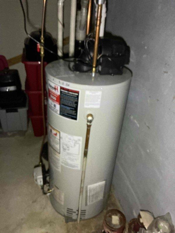 Completed comprehensive plumbing inspection of residential property, including thorough evaluation of automatic storage natural gas water heater and associated plumbing connections. Documented all findings with photographic evidence, verified proper installation of copper supply lines and overhead plumbing infrastructure, confirmed presence of required safety equipment including wall-mounted fire extinguisher, and assessed overall system functionality and code compliance.