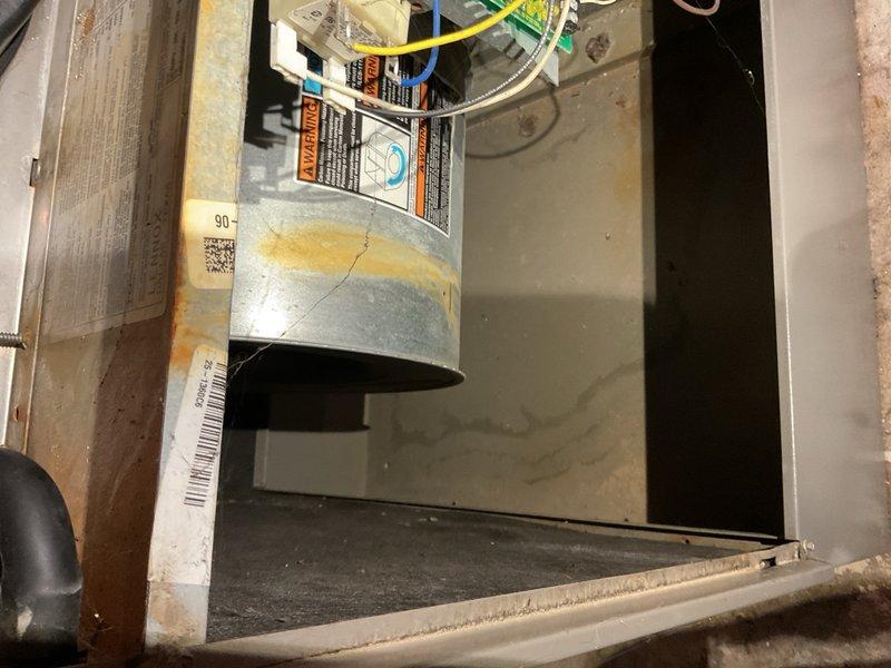 Performed comprehensive maintenance on 2006 Lennox R-22 split air conditioning system and matching gas furnace. Upon arrival, found outdoor condenser coil 100% blocked with cottonwood and debris, severely restricting heat rejection and causing abnormal operating pressures. Thoroughly cleaned condenser coil, removing all obstructions. After cleaning, system returned to normal operation with measured subcooling stabilizing between 4.9°F and 5.6°F, matching manufacturer specification of 5°F target.

Conducted full furnace inspection and testing. Verified igniter, pressure switches, burners, and flame sensor all operating within specification. Confirmed ECM blower motor functioning properly. Noted system equipped with variable-speed blower technology. Observed visible wear and discoloration on multiple areas of heat exchanger; while not currently affecting operation, these areas require monitoring on future service visits due to potential safety concerns.

Homeowner reported water dripping