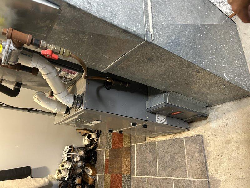 Performed comprehensive air conditioning tune-up including system operational testing, condensate drain clearing, air filter inspection, and blower compartment evaluation. Performed condenser coil cleaning, verified system pressures and temperatures, confirming all parameters within manufacturer specifications. Customer enrolled in basic maintenance plan following service completion.