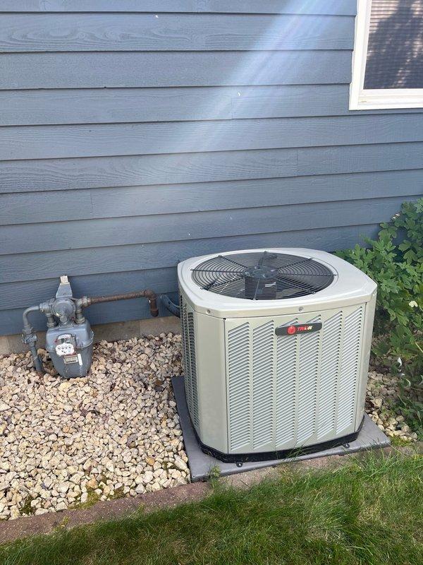 Completed comprehensive AC tune-up on Trane outdoor condensing unit. Performed full system inspection including blower motor, evaporator coil verification, and drainage system check—all components found clean and functioning properly. Conducted electrical testing on outdoor unit with all readings within manufacturer specifications. Cleaned condenser coil and ran operational test for 15 minutes, confirming proper system performance with temperature split exceeding 20 degrees across the evaporator. Customer reported no concerns and confirmed recent filter replacement. System operating efficiently with no deficiencies noted. Recommended continuing routine preventive maintenance schedule.