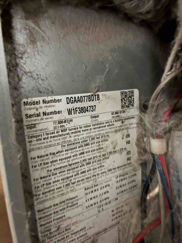 Responded to no cooling call on 2013 Revolv mobile home furnace (Model DGAA077BDTB). Diagnosed blower motor failure after verifying thermostat call for cooling, confirming control board output of 120V to motor, and testing capacitor which measured within acceptable range. Blower motor failed to start despite proper voltage supply, indicating motor winding failure. Overall system condition showed significant neglect with heavy dust accumulation and lack of maintenance. Provided repair estimate for blower motor replacement, recommended full system evaluation due to deteriorated equipment condition, but customer declined additional assessment and authorized motor replacement only. Completed parts order documentation for new blower motor assembly.