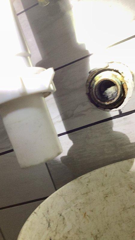 Responded to a bathroom lavatory drain issue where standing water remained in the sink following customer's P-trap cleaning attempt. Upon arrival, diagnosed a plugged lavatory drain line beyond the P-trap assembly. Utilized drain snake equipment to clear the obstruction in the lavatory pipe, restoring proper drainage function. Verified drain plug assembly was correctly installed and tested system to confirm water flow was operating normally with no standing water remaining in the fixture.