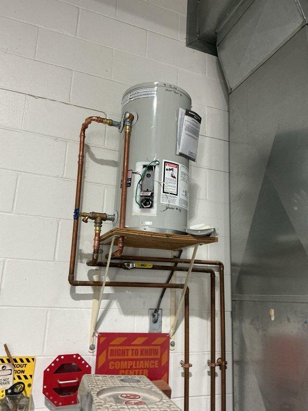 Responded to commercial property for no hot water issue on recently installed water heater. Upon inspection, diagnosed failed heating element with severe corrosion and mineral deposit buildup. Removed defective heating element and documented condition. Submitted purchase order request for replacement heating element to restore hot water service to business.