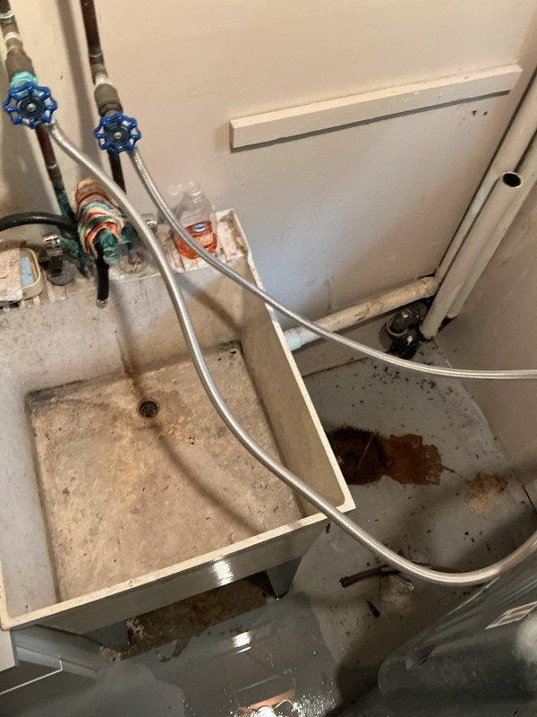 Responded to a clogged floor drain beneath the washing machine that was causing standing water in the laundry area. Upon arrival, diagnosed the floor drain as completely blocked with debris, preventing proper drainage. Cabled the floor drain line to clear all obstructions and restored full drainage capacity, then tested the system to verify proper operation. Additionally, installed a customer-supplied laundry tub with faucet, making all necessary water supply line connections with proper shut-off valves. Conducted multiple fill-and-drain tests to ensure leak-free operation and confirmed all fixtures were functioning correctly with no water leaks present at the completion of the service.