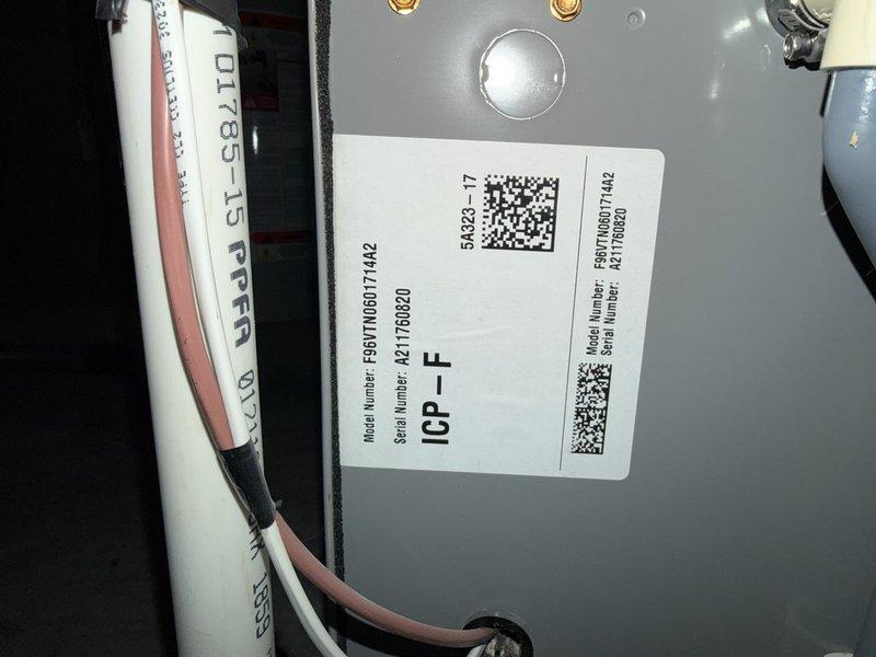 Responded to no cooling complaint on 5-year-old unit experiencing evaporator coil freezing. Diagnosed system as low on R-410A refrigerant, indicating a leak in the system. Discussed findings and repair options with homeowner, who authorized refrigerant recharge with UV dye for future leak detection. Added 2 pounds of R-410A refrigerant and fluorescent dye to system. Verified proper system operation with 15-degree temperature split across evaporator coil. Provided estimates for comprehensive leak repair services. System restored to normal cooling operation.