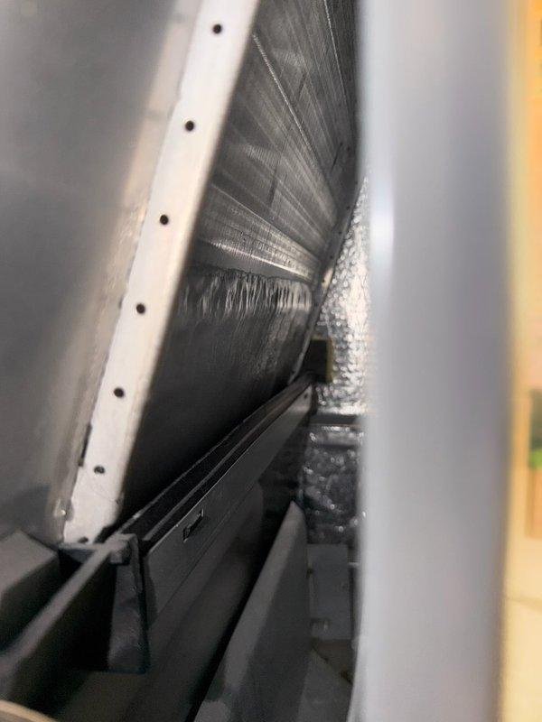 Responded to no cooling complaint on 5-year-old unit experiencing evaporator coil freezing. Diagnosed system as low on R-410A refrigerant, indicating a leak in the system. Discussed findings and repair options with homeowner, who authorized refrigerant recharge with UV dye for future leak detection. Added 2 pounds of R-410A refrigerant and fluorescent dye to system. Verified proper system operation with 15-degree temperature split across evaporator coil. Provided estimates for comprehensive leak repair services. System restored to normal cooling operation.