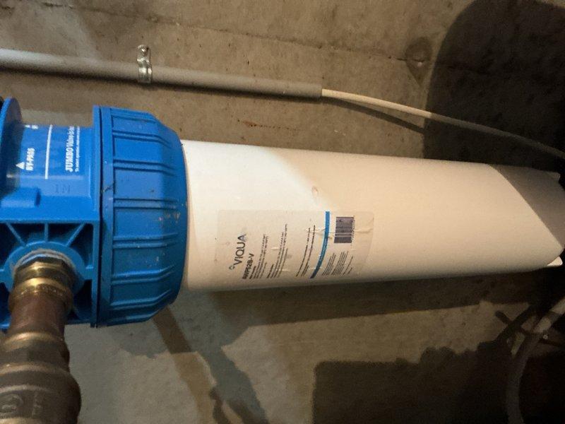Responded to low water pressure complaint affecting kitchen faucet. Diagnosed sediment buildup in faucet aerator and clogged whole-house sediment filter as primary causes of reduced flow. Cleaned faucet head to restore proper flow rate. Identified malfunctioning softener head requiring attention. Advised customer that sediment filter replacement is needed and recommended scheduling estimate for water softener replacement due to head assembly issues.