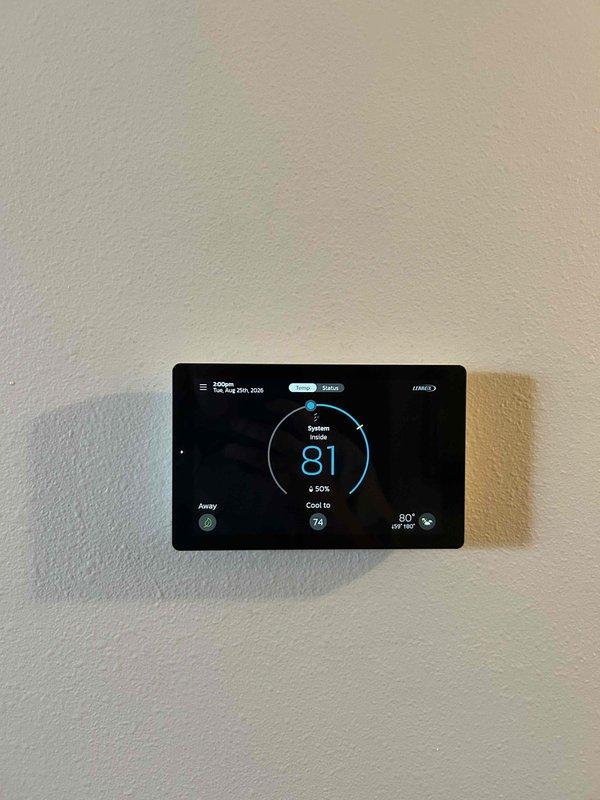 Replaced defective thermostat with new S40 smart thermostat under parts warranty. Removed old thermostat, installed new base plate with proper wire terminations (R, Y, G, C wiring), mounted S40 unit, configured system settings, and established remote access functionality on homeowner's mobile device for complete system control.
